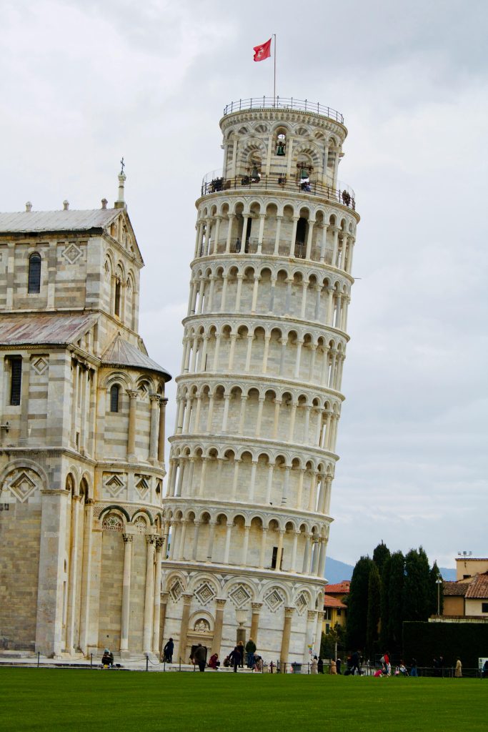 The Leaning Tower of Pisa, one of Italy's most iconic landmarks, is famous for its unintended tilt. Located in the Piazza dei Miracoli, this medieval bell tower is a marvel of Romanesque architecture. Visitors from around the world come to admire its unique lean, which was caused by unstable foundation soil. Climb the tower for breathtaking views of Pisa and its surroundings, and experience a piece of history that dates back to the 12th century.